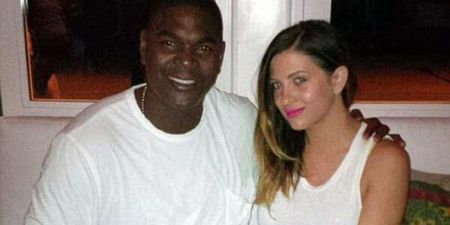 Keyshawn Johnson and his wife pose a picture.